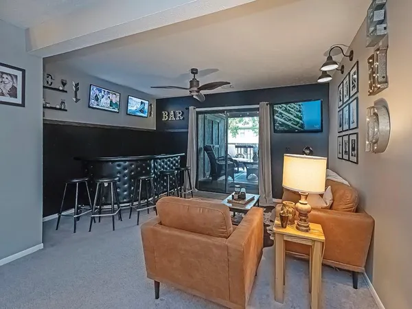 a living room with furniture and a large window