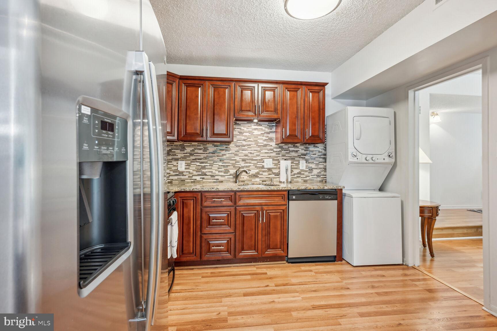 11833 Shire Court, Unit 2C Reston, VA 20191 - Photo 11 of 20 Granite Counters and Tile Backsplash