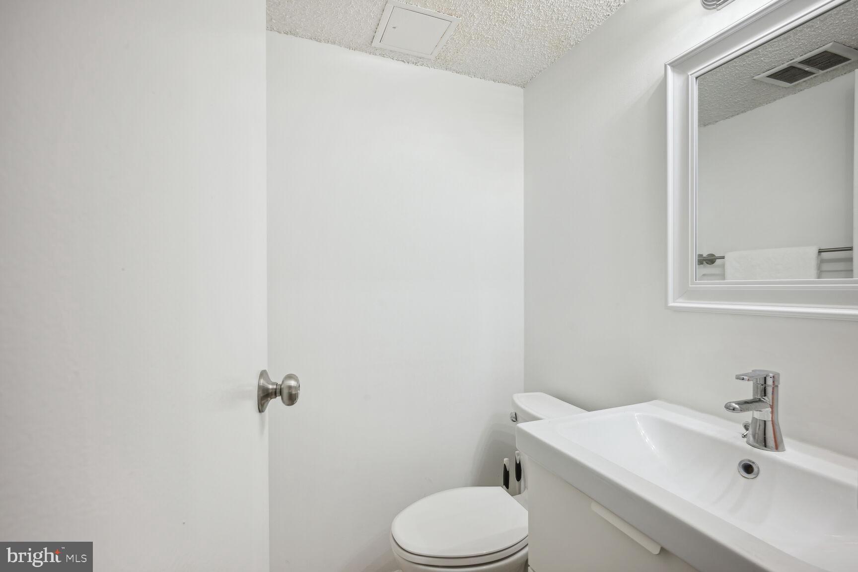 11833 Shire Court, Unit 2C Reston, VA 20191 - Photo 14 of 20 Powder Room off Primary Bedroom