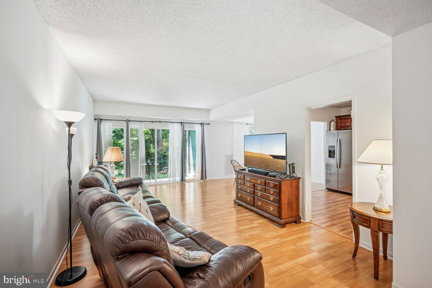 11833 Shire Court, Unit 2C Reston, VA 20191 - Photo 4 of 20 Open, Light-filled Living Room