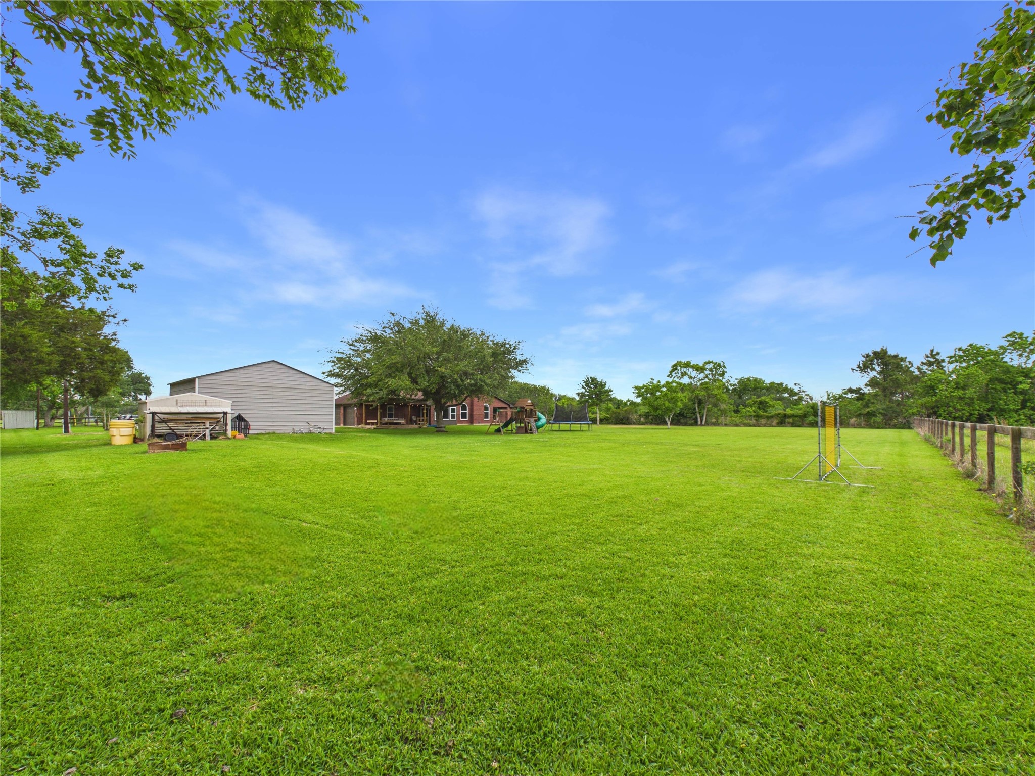 4610 Mustang Road Alvin, TX 77511 - Photo 47 of 50 Yep....this corner is yours too! Don't wait! Snatch this one while you can! You know what's better than "buying dirt".....buying a charming 3-2-4 on LOTS OF DIRT (covered with the green, green grass of home!).