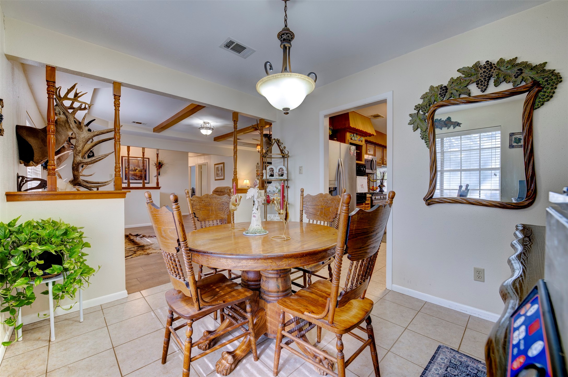 1664 Farm To Market 1010 Road Cleveland, TX 77327 - Photo 12 of 50 a view of a dining room with furniture and a chandelier