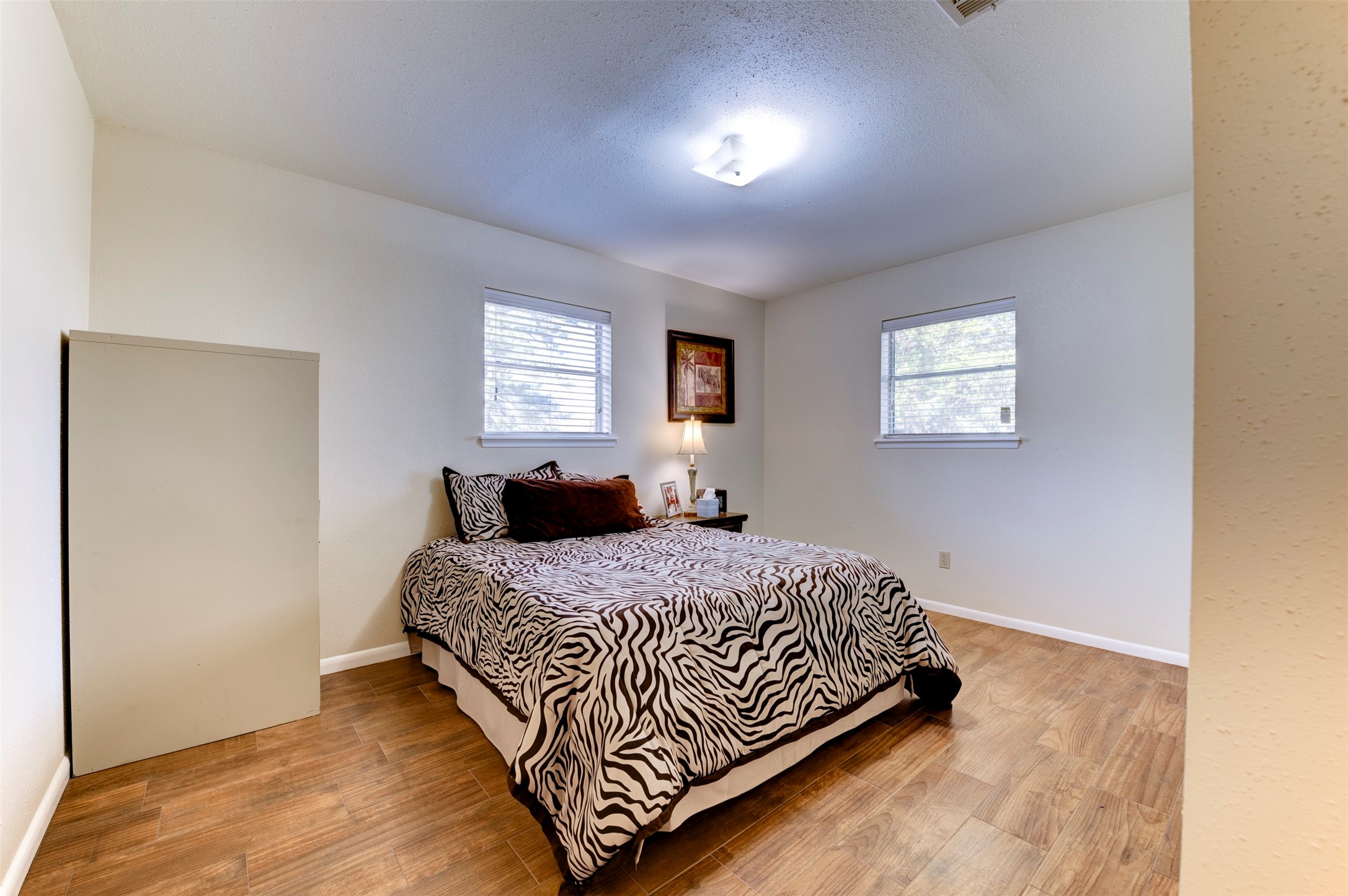 1664 Farm To Market 1010 Road Cleveland, TX 77327 - Photo 19 of 50 a bedroom with a bed and window
