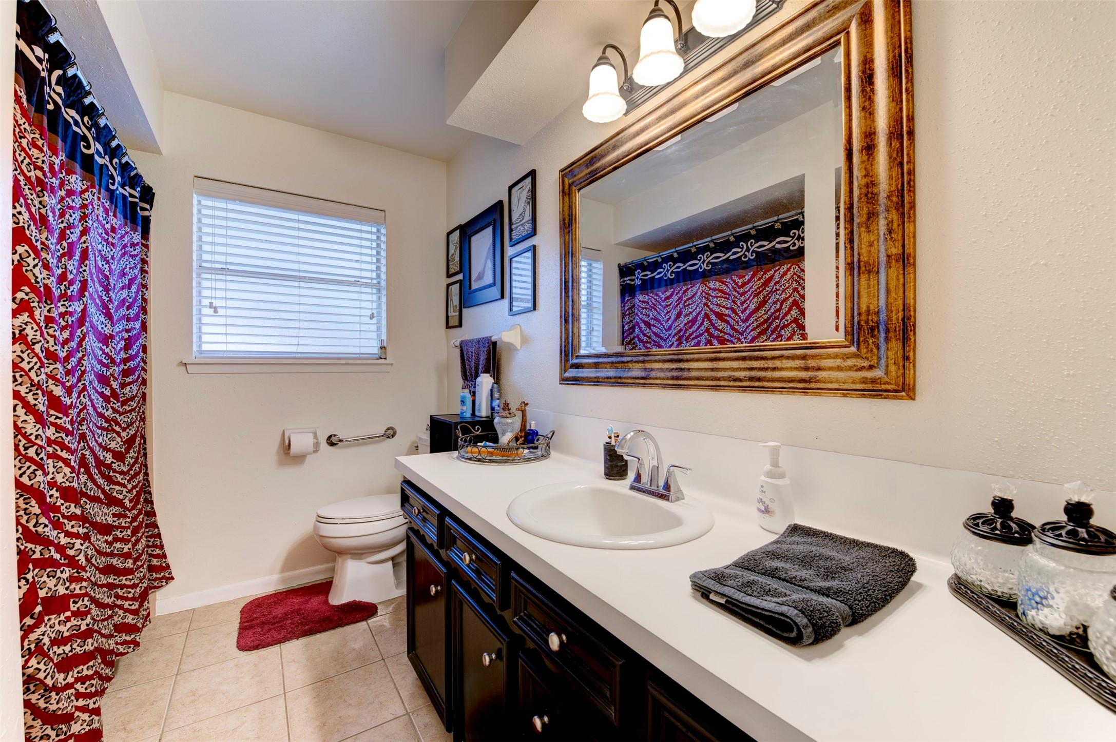1664 Farm To Market 1010 Road Cleveland, TX 77327 - Photo 20 of 50 a bathroom with a sink and a mirror
