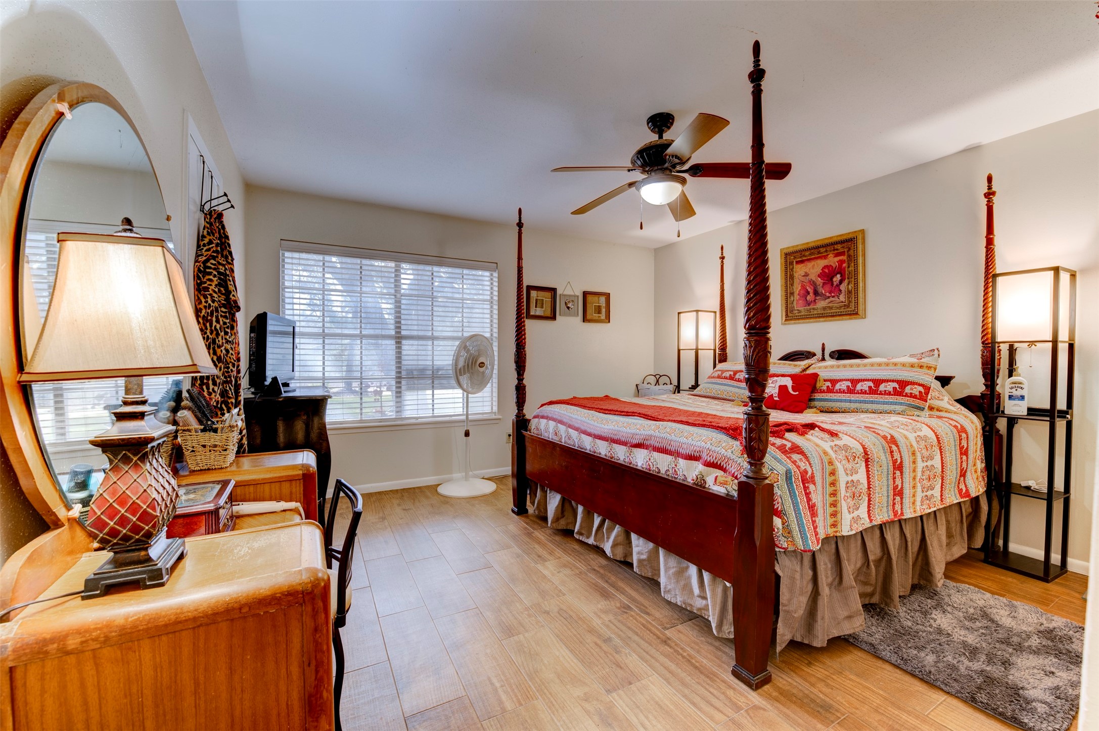 1664 Farm To Market 1010 Road Cleveland, TX 77327 - Photo 21 of 50 a bedroom with a bed and wooden floor