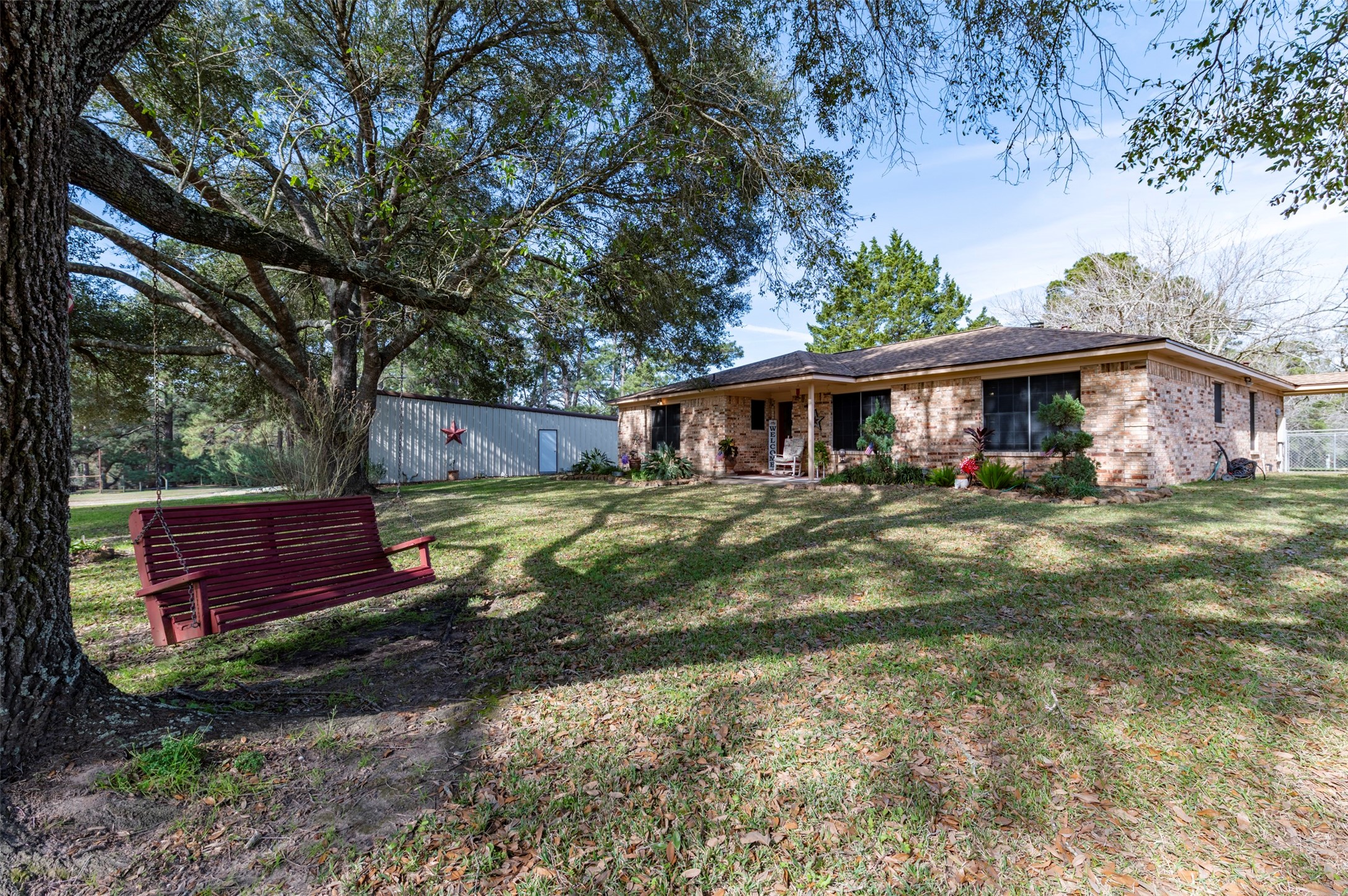 1664 Farm To Market 1010 Road Cleveland, TX 77327 - Photo 24 of 50 a view of a house with a yard