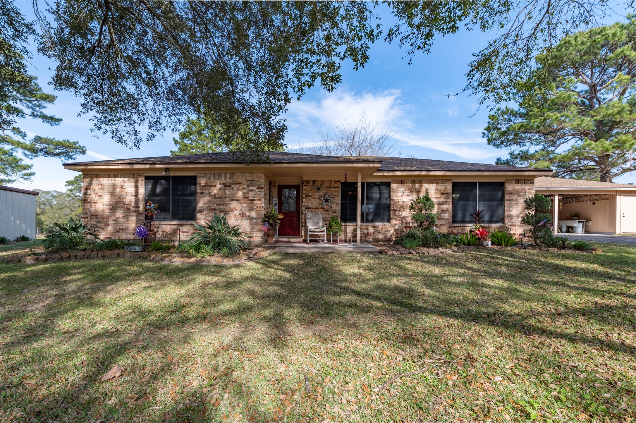 1664 Farm To Market 1010 Road Cleveland, TX 77327 - Photo 25 of 50 front view of a house with a yard
