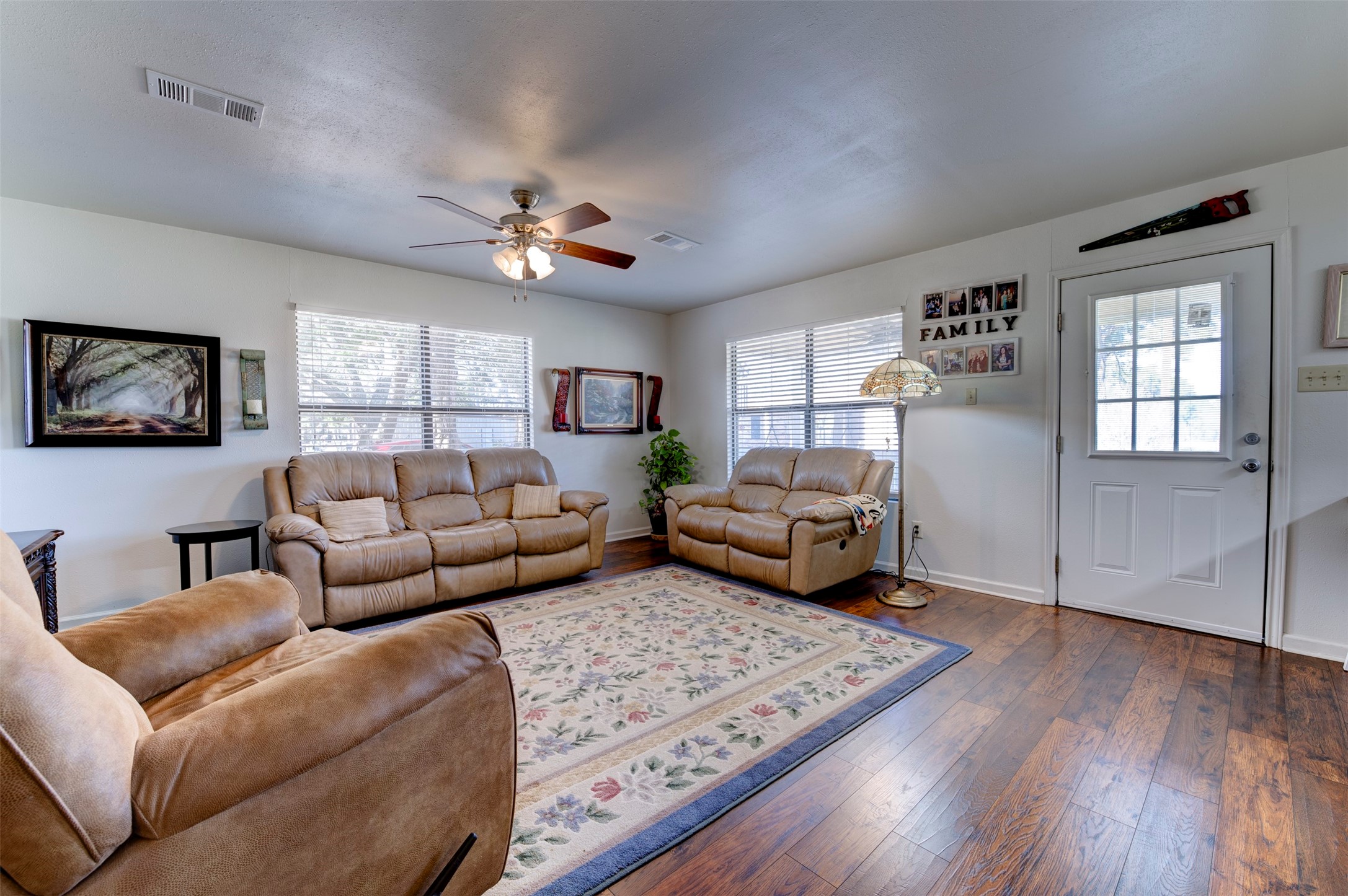 1664 Farm To Market 1010 Road Cleveland, TX 77327 - Photo 32 of 50 a living room with furniture ceiling fan and a wooden floor