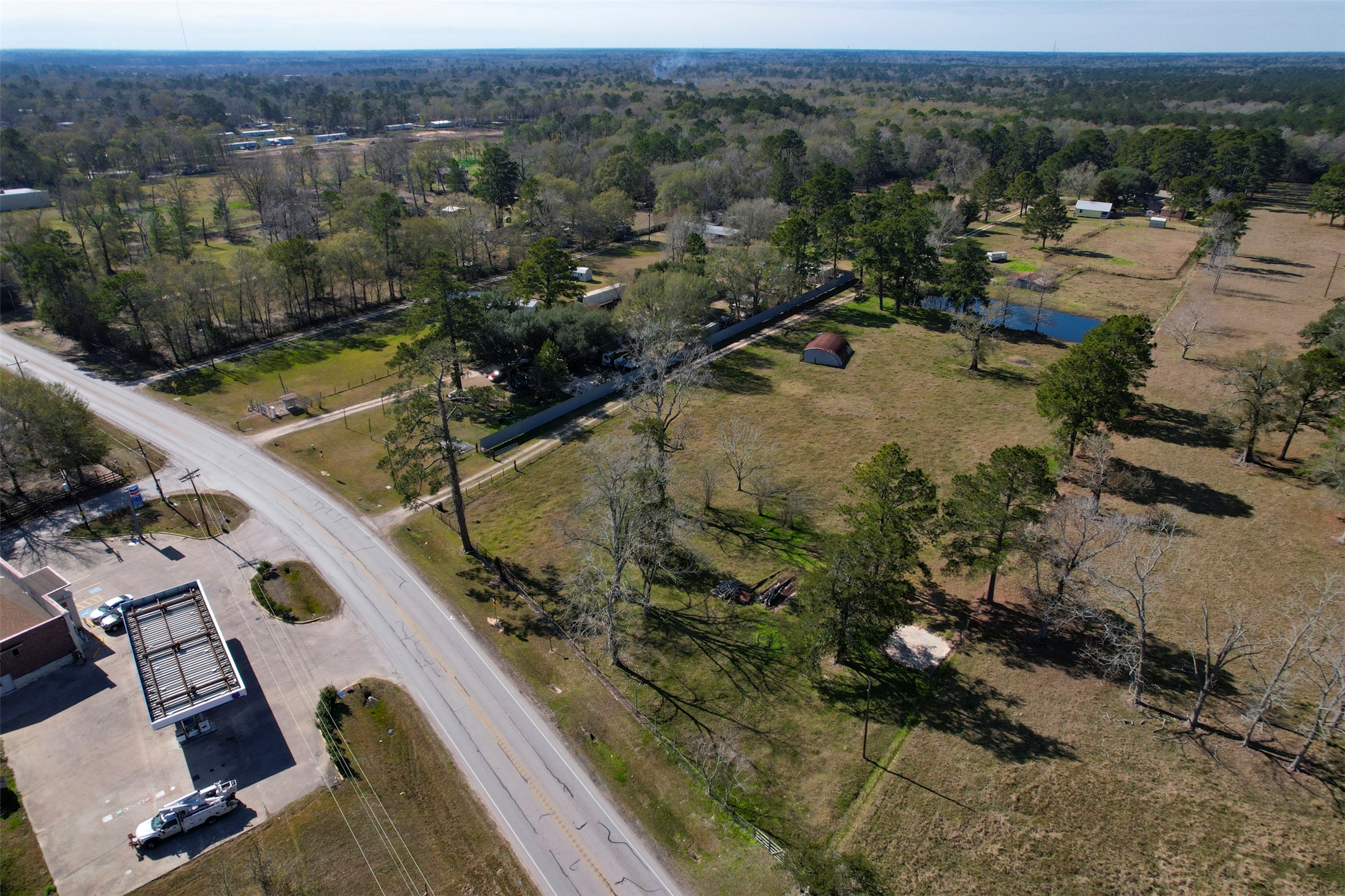1664 Farm To Market 1010 Road Cleveland, TX 77327 - Photo 49 of 50 an aerial view of a house with a yard