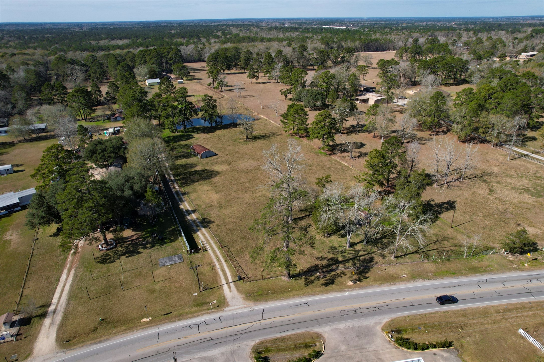 1664 Farm To Market 1010 Road Cleveland, TX 77327 - Photo 50 of 50 an aerial view of residential houses with outdoor space