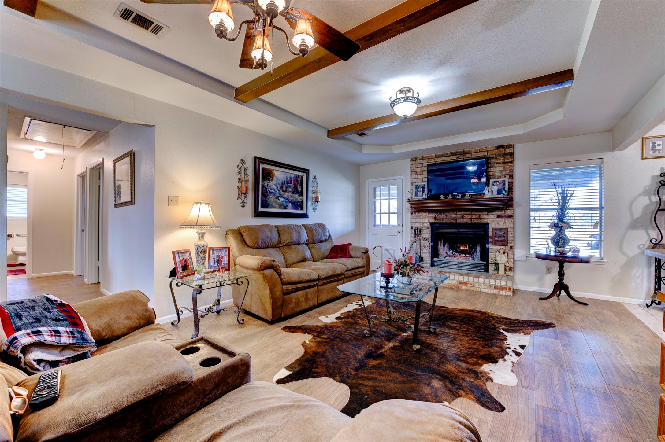 1664 Farm To Market 1010 Road Cleveland, TX 77327 - Photo 6 of 50 a living room with furniture a fireplace and a flat screen tv