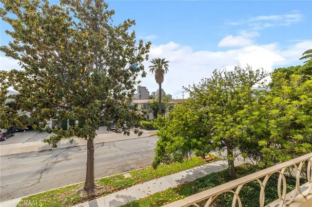 a front view of a house with trees