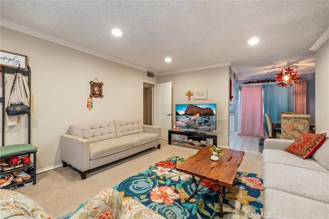 a kitchen with white cabinets and appliances