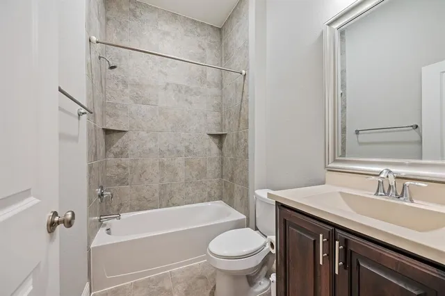a bathroom with a sink a toilet and a bathtub