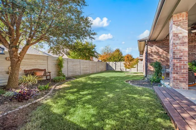 a view of backyard with garden and entertaining space