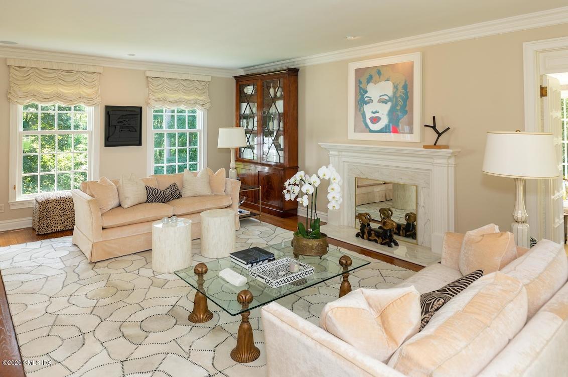 23 Boulder Brook Road Greenwich, CT 06830 - Photo 3 of 27 a living room with furniture and a fireplace