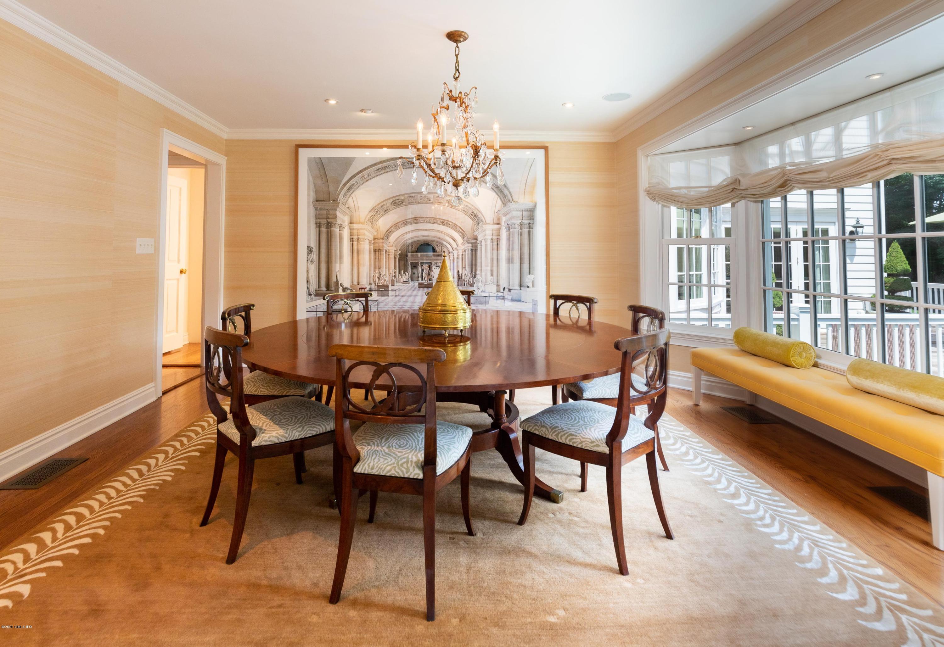 23 Boulder Brook Road Greenwich, CT 06830 - Photo 6 of 27 a dining room with furniture a chandelier and wooden floor