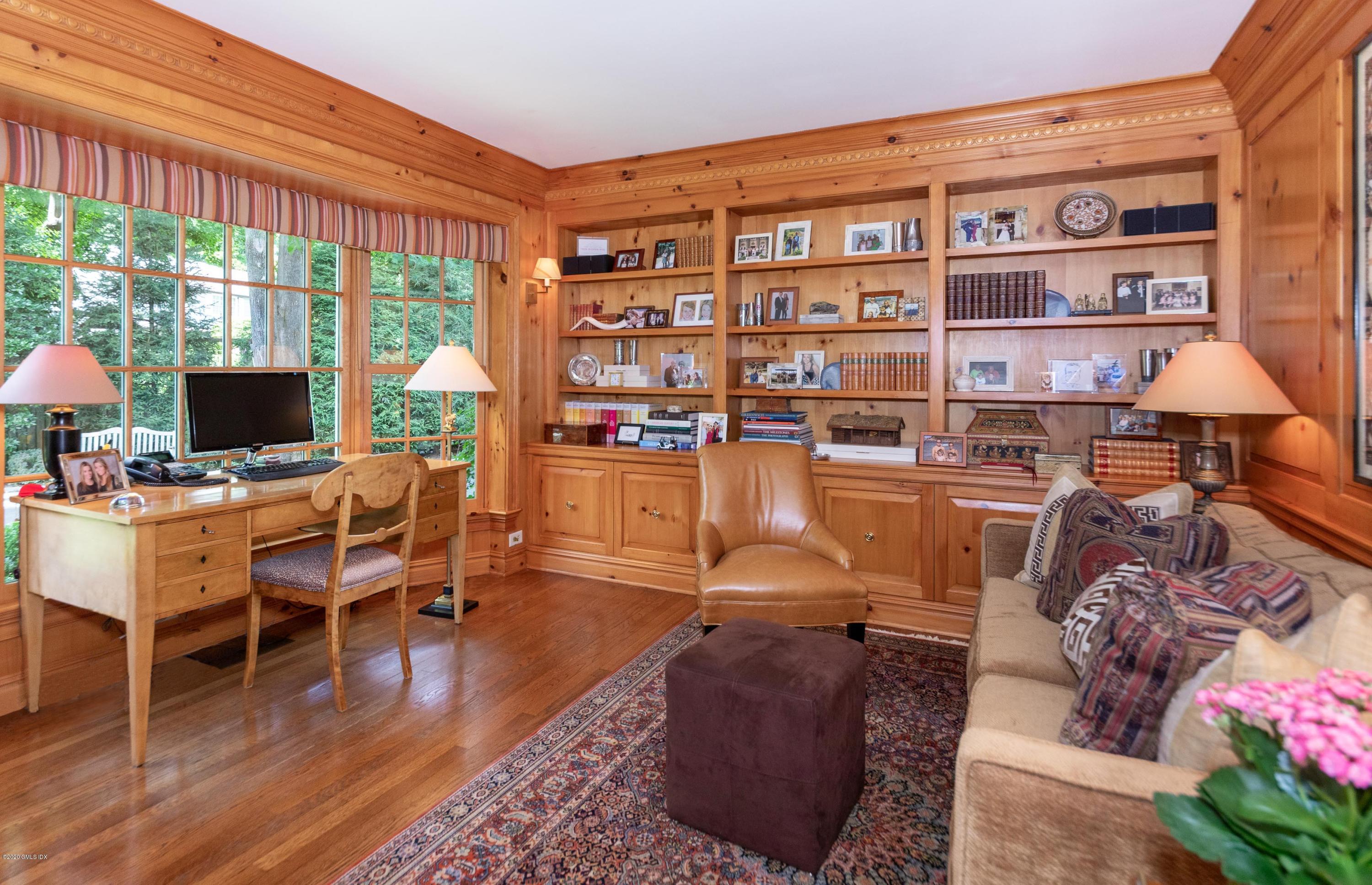 23 Boulder Brook Road Greenwich, CT 06830 - Photo 8 of 27 a living room with furniture a rug and a floor to ceiling window
