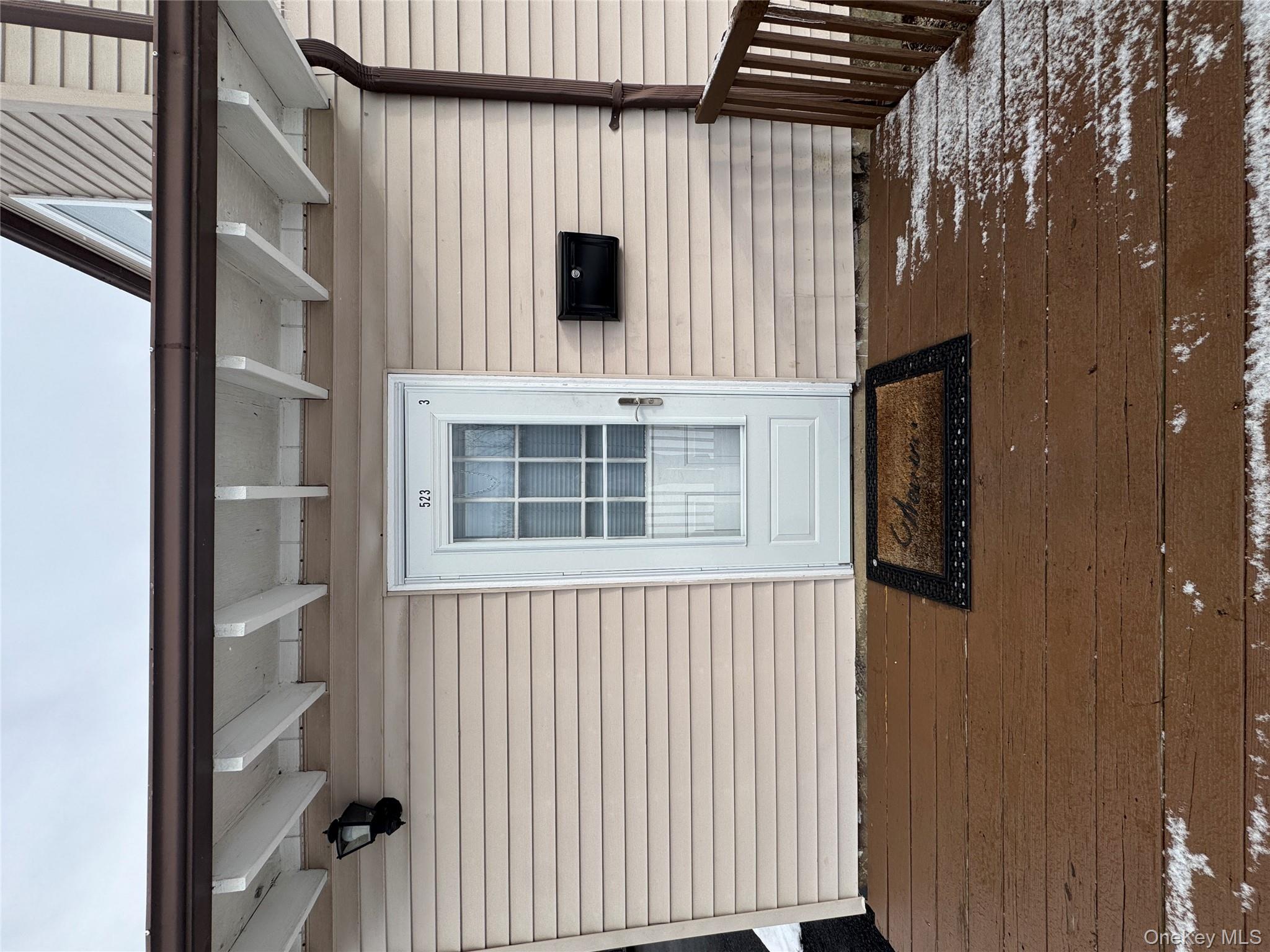 Doorway to property featuring a deck