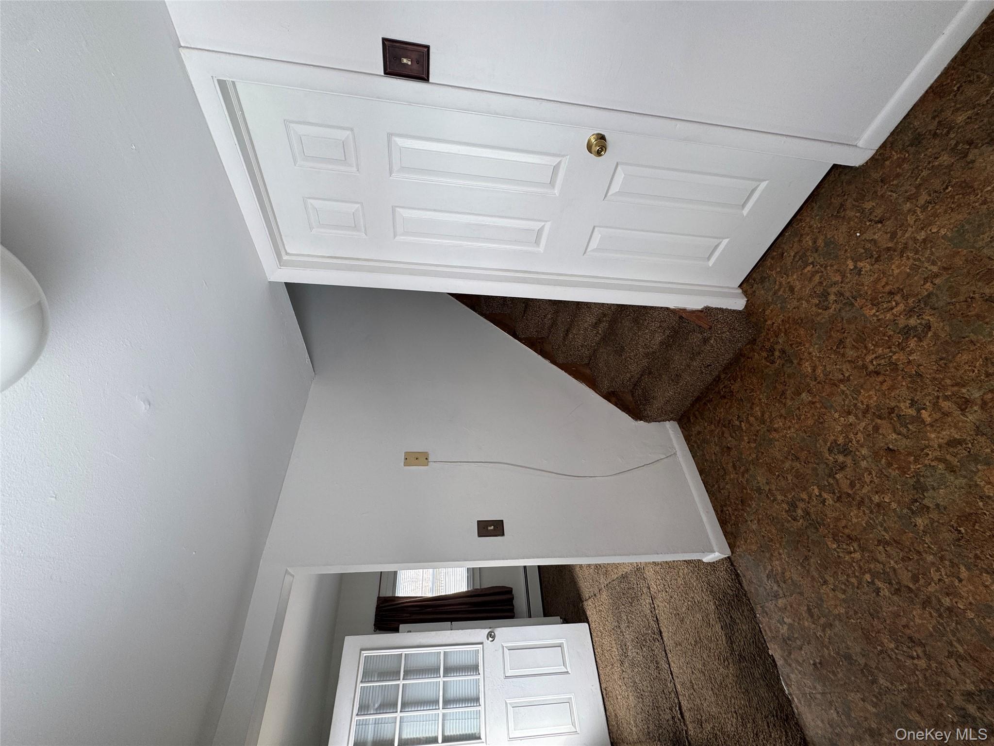 523 Fostertown Road Newburgh, NY 12550 - Photo 9 of 15 Basement featuring dark colored carpet and stairway