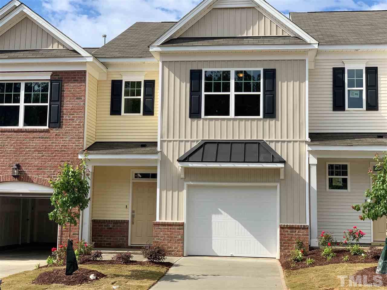 a front view of a house with garage