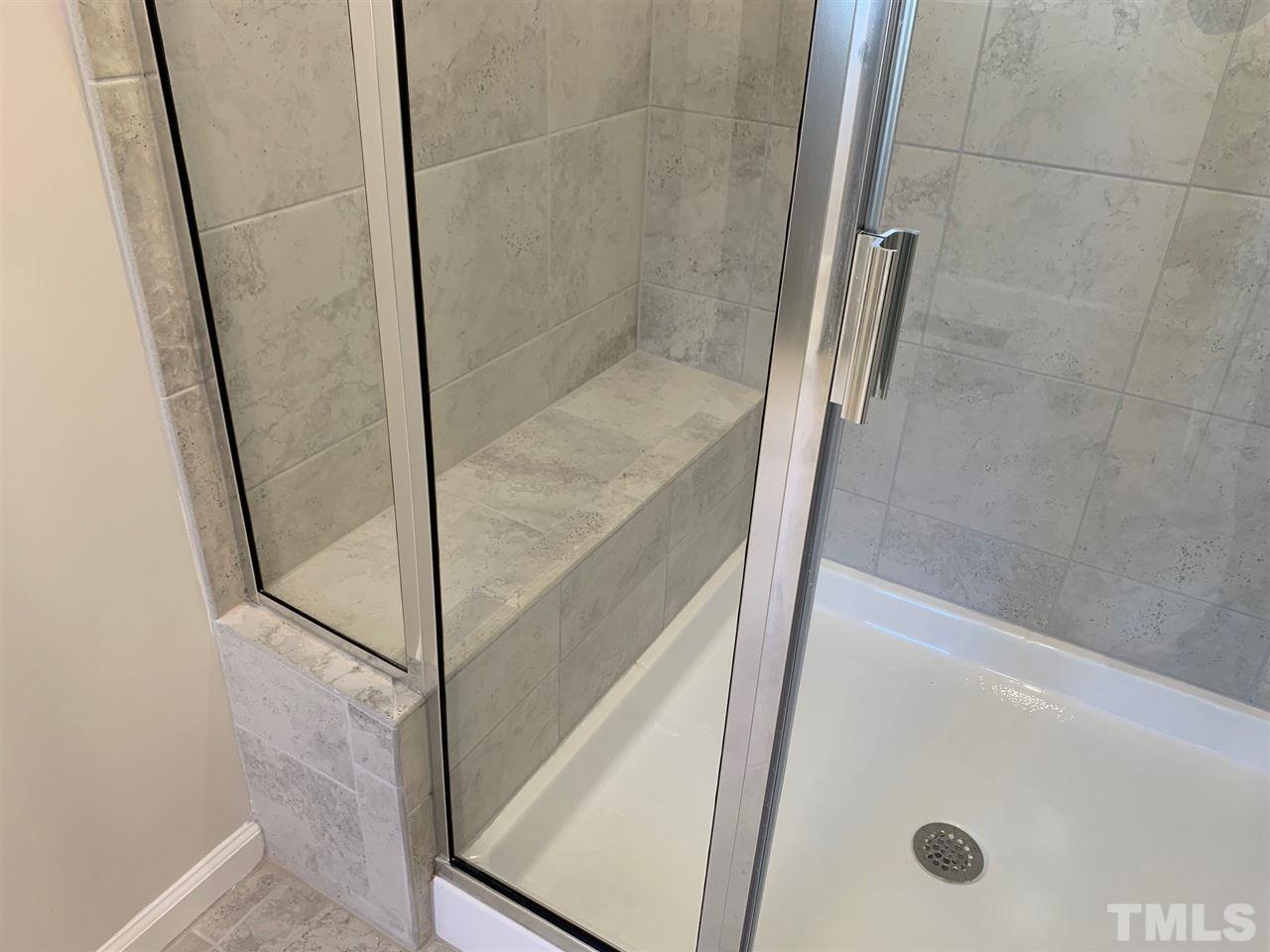 6108 Beale Loop, Unit 101 Raleigh, NC 27616 - Photo 15 of 30 a bathroom with a shower