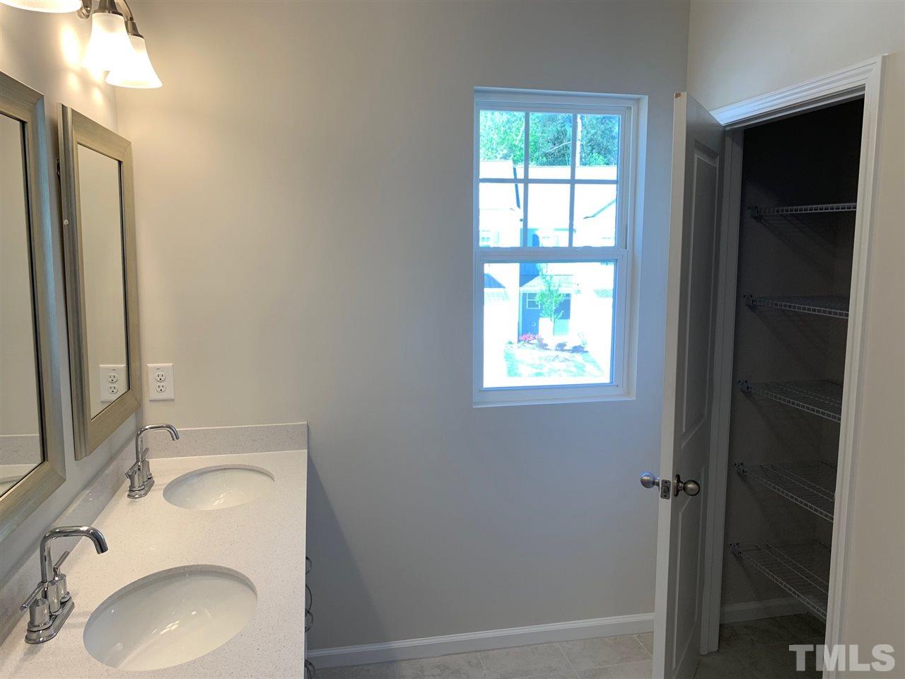 6108 Beale Loop, Unit 101 Raleigh, NC 27616 - Photo 16 of 30 a bathroom with a sink toilet and shower