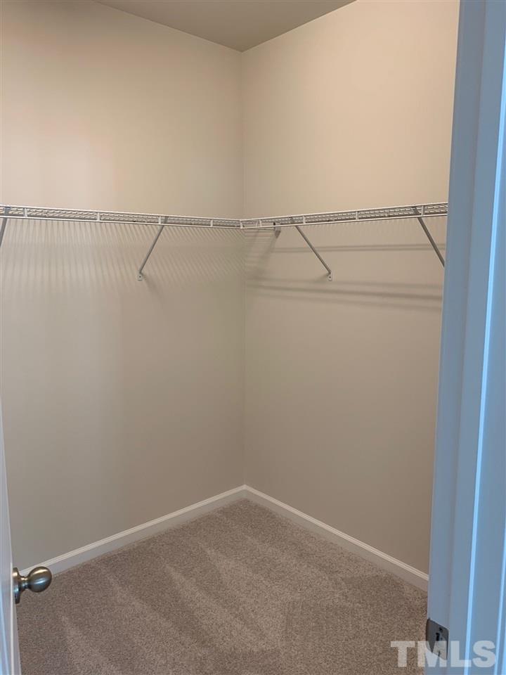 6108 Beale Loop, Unit 101 Raleigh, NC 27616 - Photo 17 of 30 a view of a room with racks on the wall