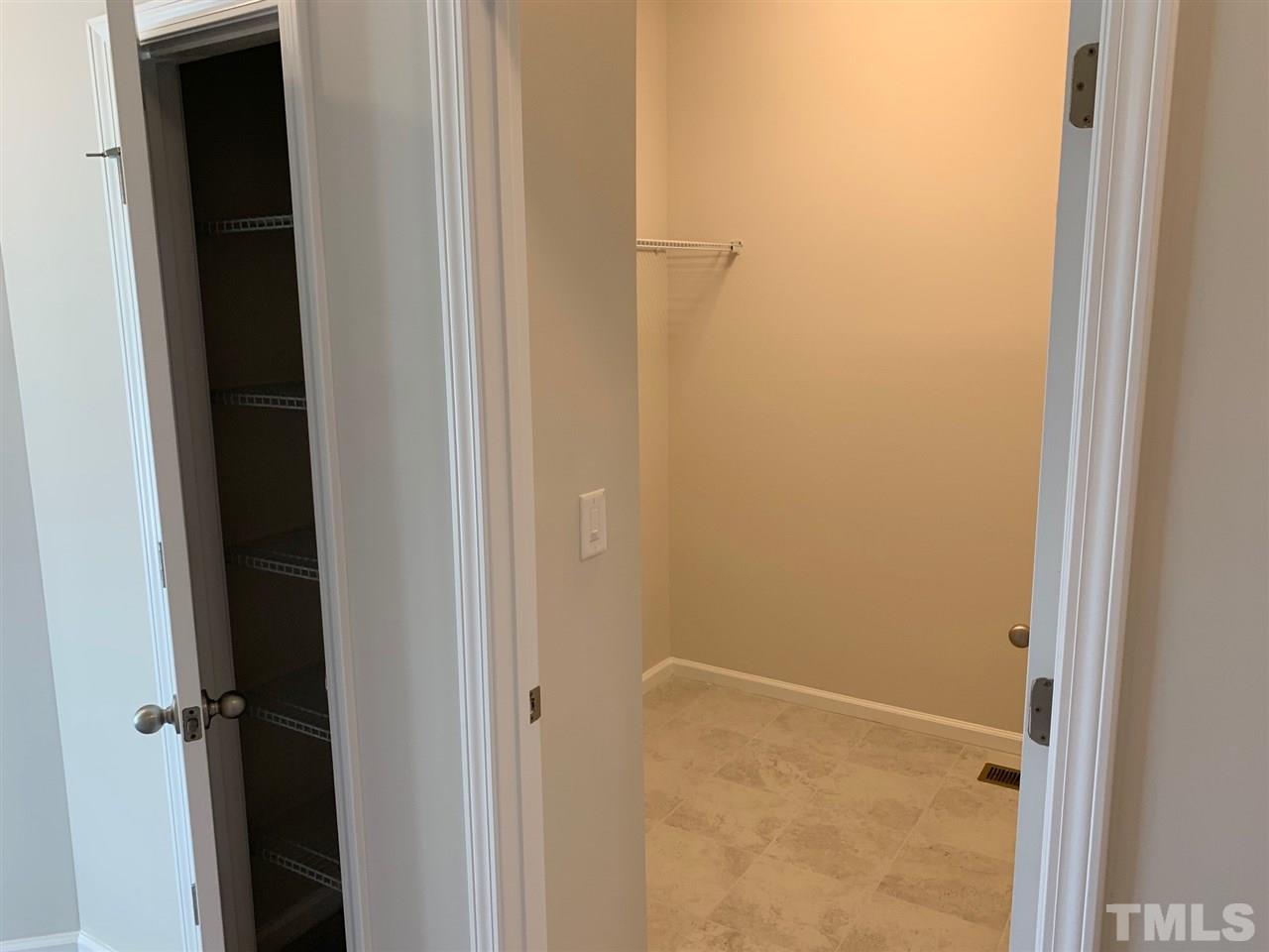 6108 Beale Loop, Unit 101 Raleigh, NC 27616 - Photo 19 of 30 a bathroom with a glass door