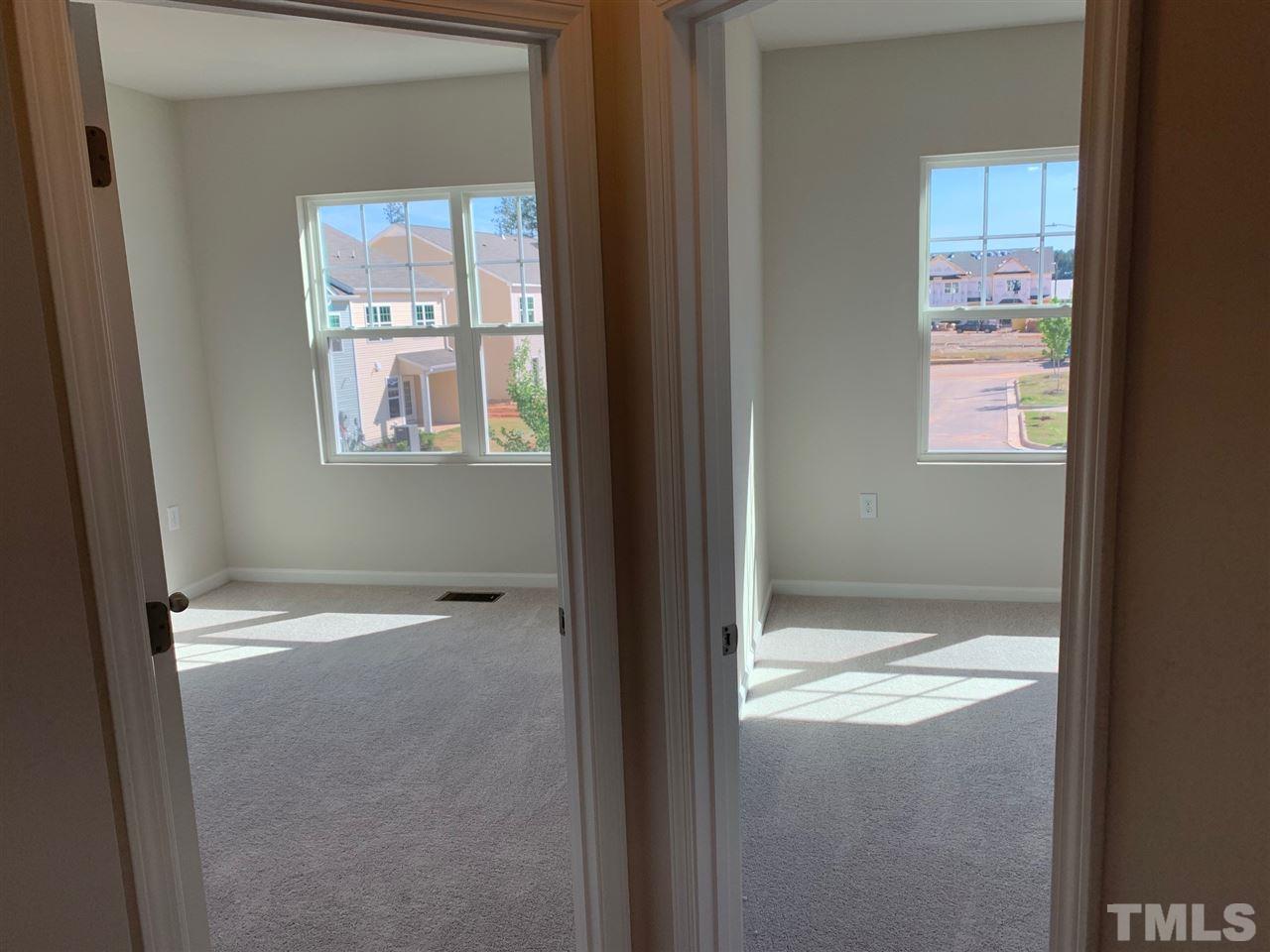 6108 Beale Loop, Unit 101 Raleigh, NC 27616 - Photo 21 of 30 a view of an empty room with a window