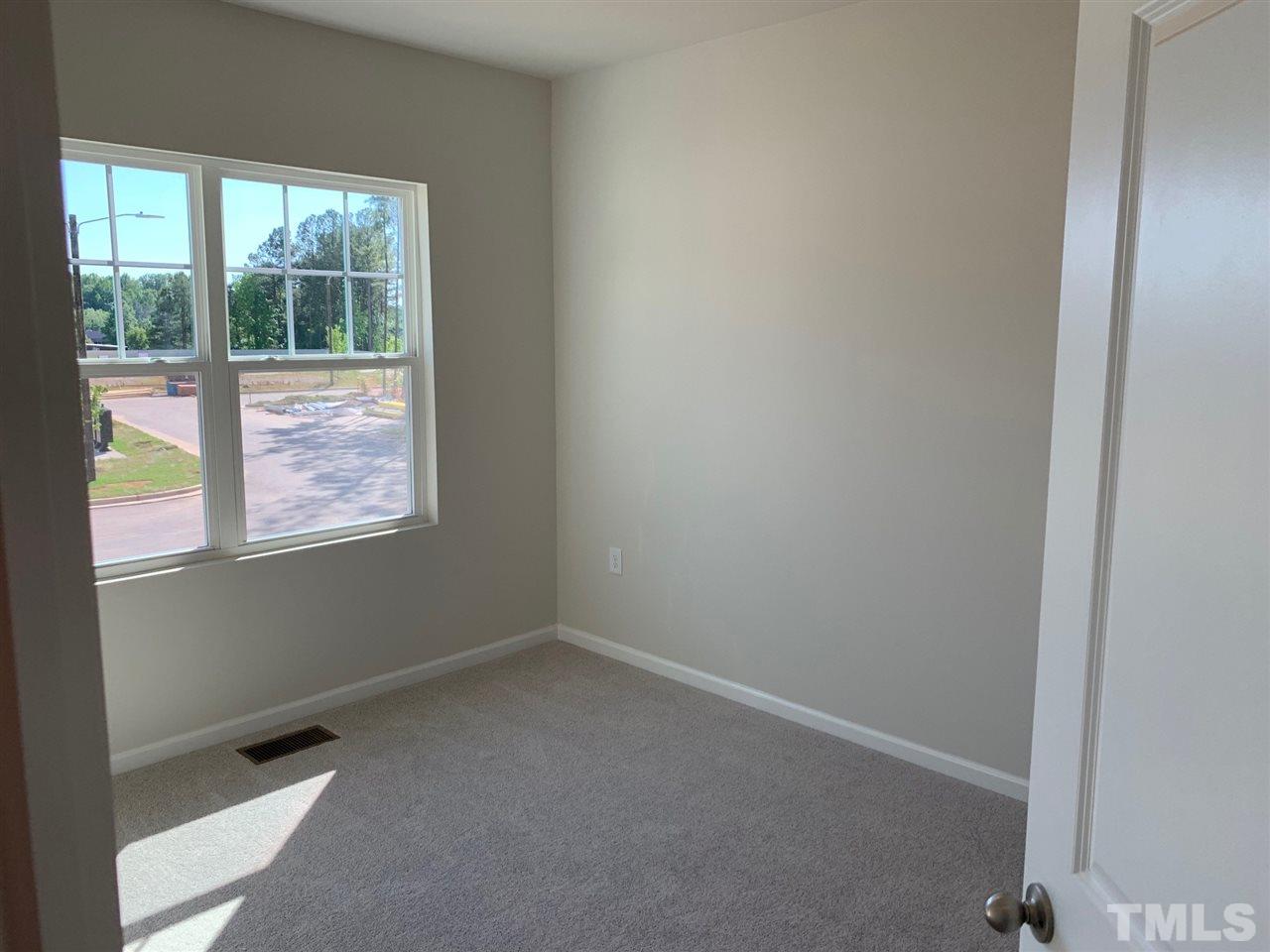 6108 Beale Loop, Unit 101 Raleigh, NC 27616 - Photo 22 of 30 an empty room with a window