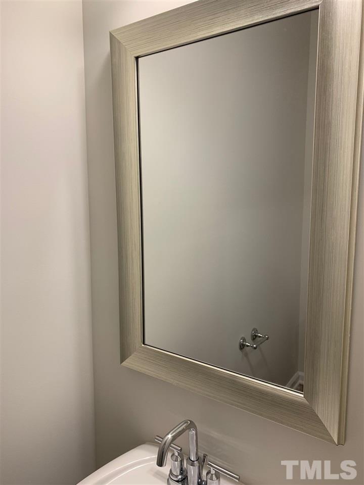 6108 Beale Loop, Unit 101 Raleigh, NC 27616 - Photo 9 of 30 a bathroom with a shower and a sink