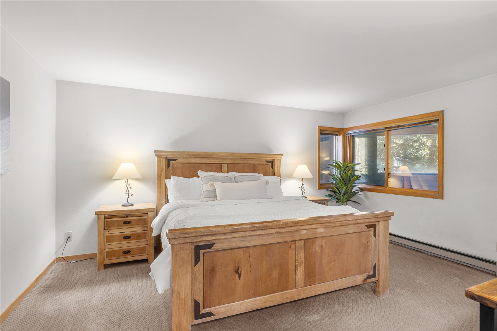 22804 Highway 6, Unit 102 Keystone, CO 80435 - Photo 13 of 34 a bedroom with a bed and a window