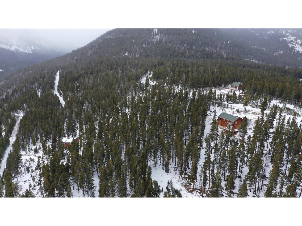 37 Vista Road Idaho Springs, CO 80452 - Photo 18 of 27 a black and white photo of a lake