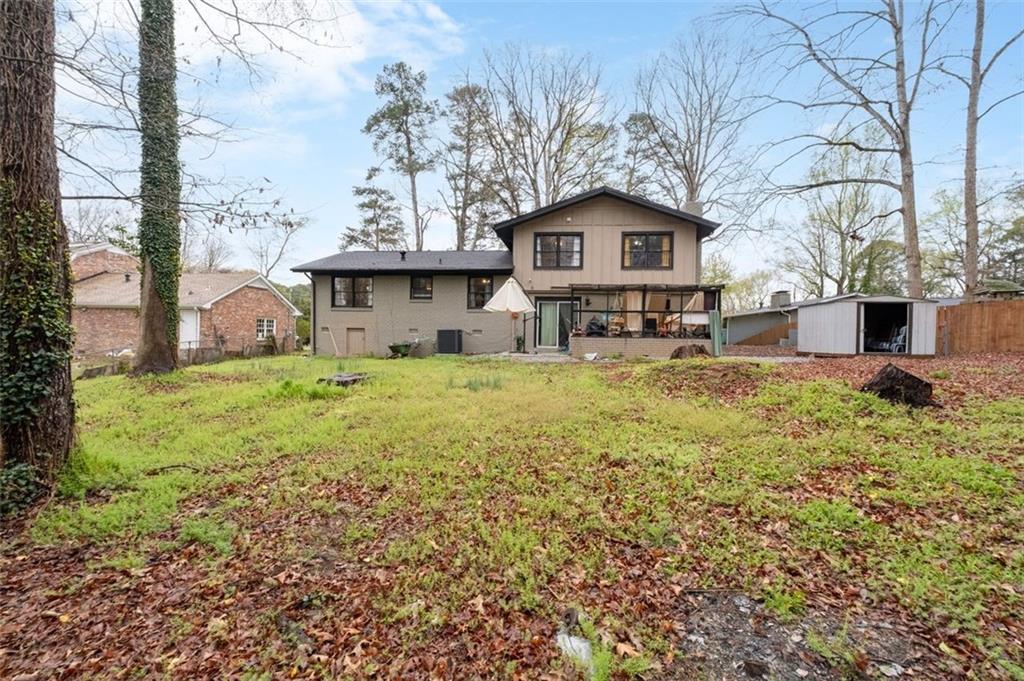 957 Rowland Road Stone Mountain, GA 30083 - Photo 36 of 36 a front view of a house with garden