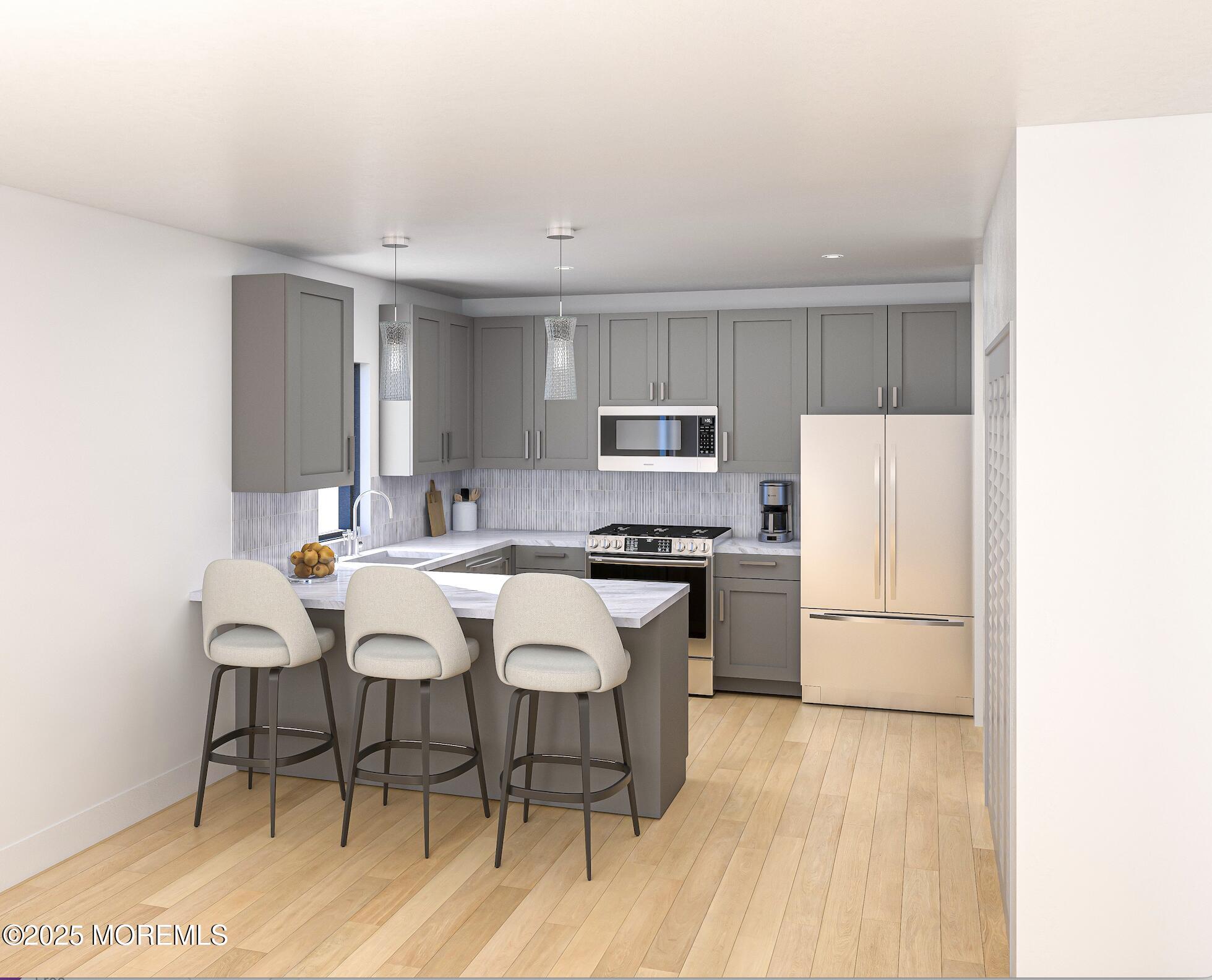 180 Morris Avenue, Unit 304 Long Branch, NJ 07740 - Photo 4 of 11 a kitchen with stainless steel appliances a refrigerator a stove a sink dishwasher and white cabinets with wooden floor