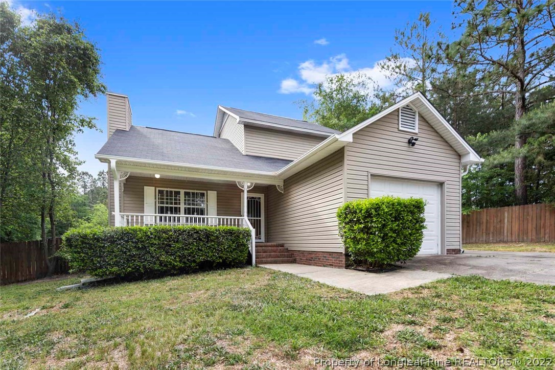 228 Overton Road Raeford, NC 28376 - Photo 1 of 23 a front view of a house with garden
