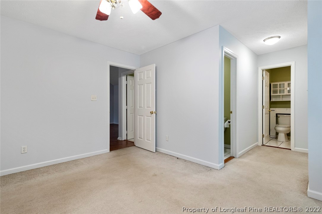 228 Overton Road Raeford, NC 28376 - Photo 13 of 23 an empty room with closet and a chandelier fan