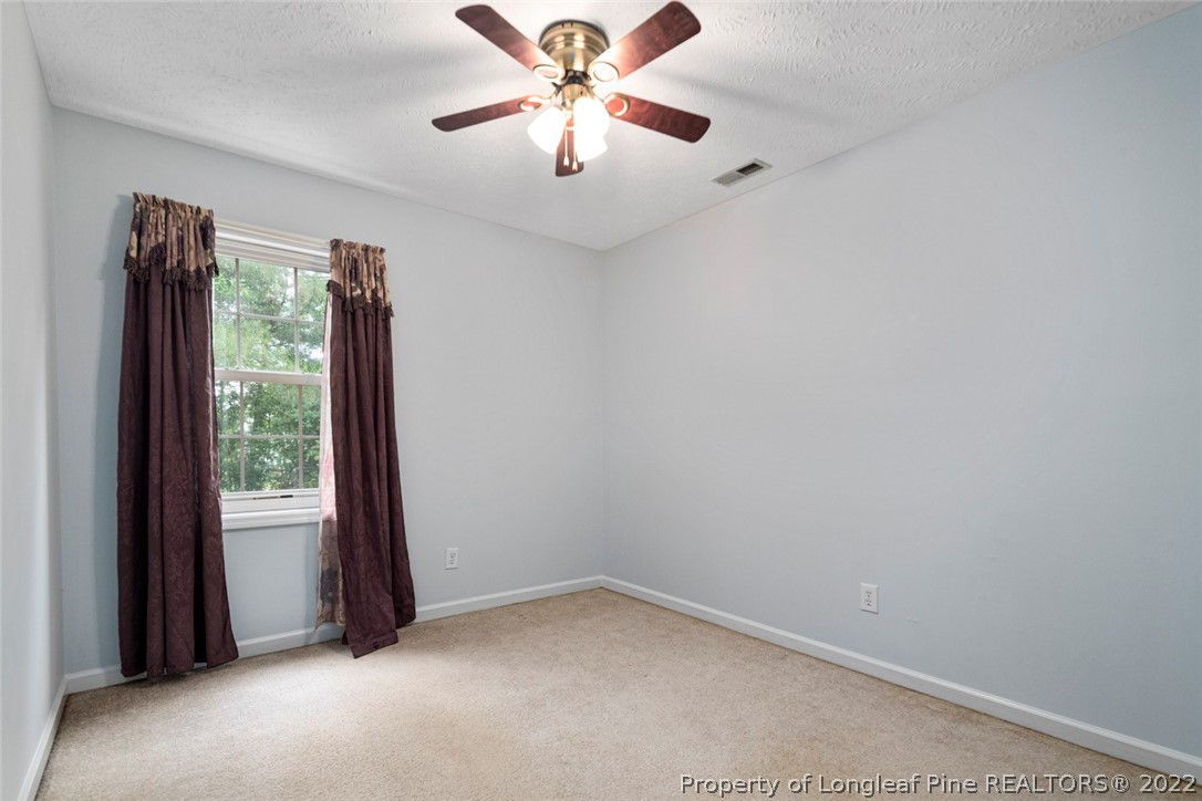 228 Overton Road Raeford, NC 28376 - Photo 18 of 23 a view of an empty room with a window