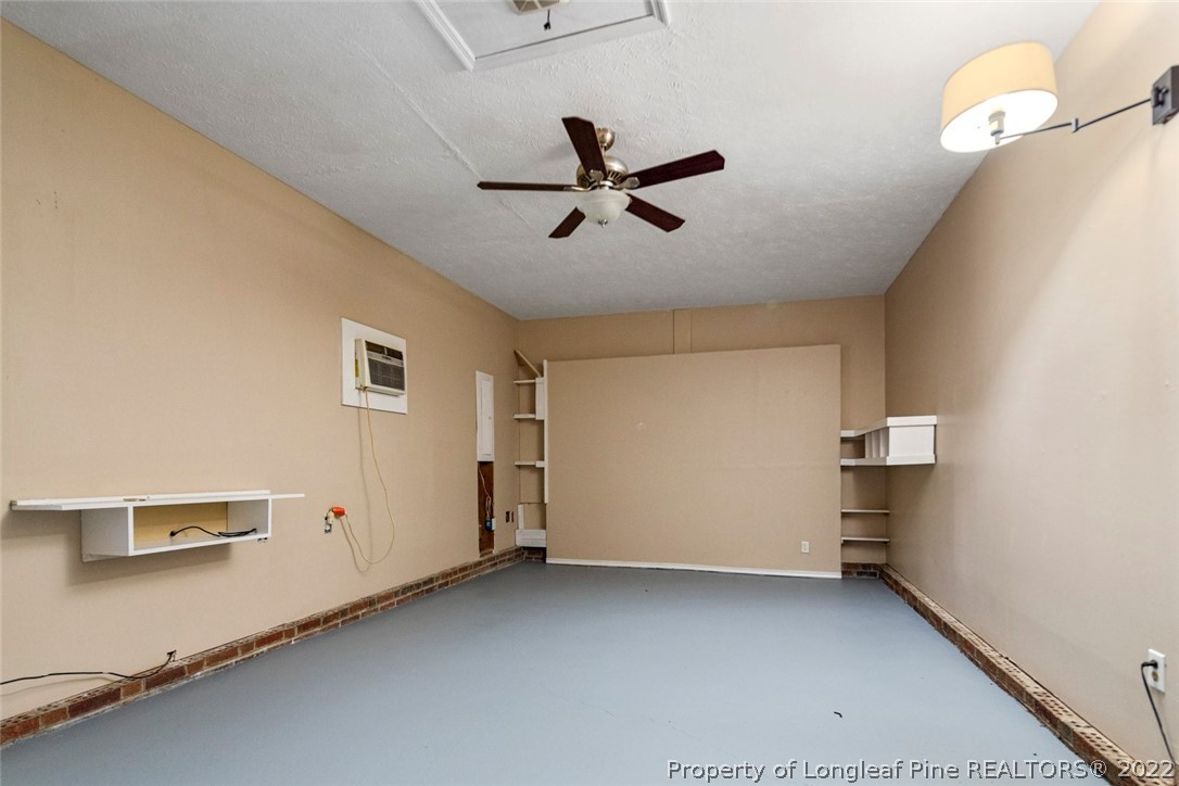 228 Overton Road Raeford, NC 28376 - Photo 20 of 23 a view of a livingroom with a ceiling fan and window