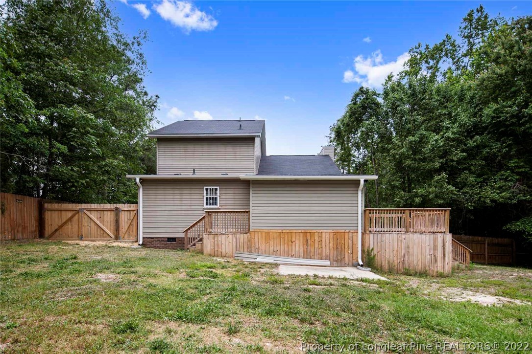 228 Overton Road Raeford, NC 28376 - Photo 23 of 23 a view of a house with backyard and a tree