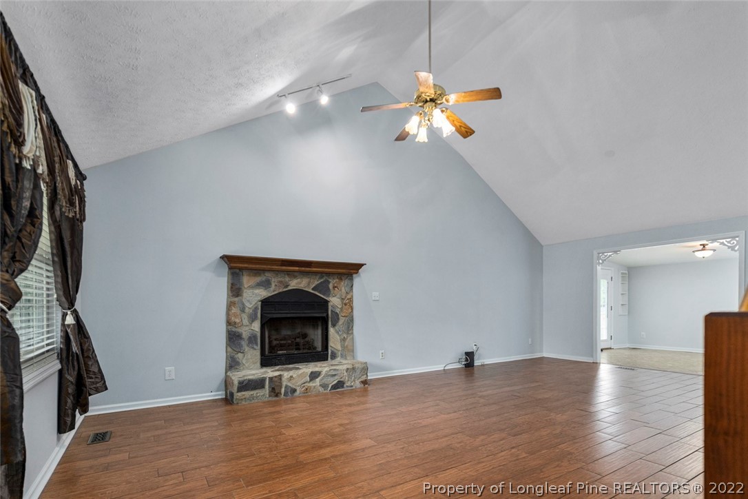 228 Overton Road Raeford, NC 28376 - Photo 7 of 23 a view of an empty room with ceiling fan and window