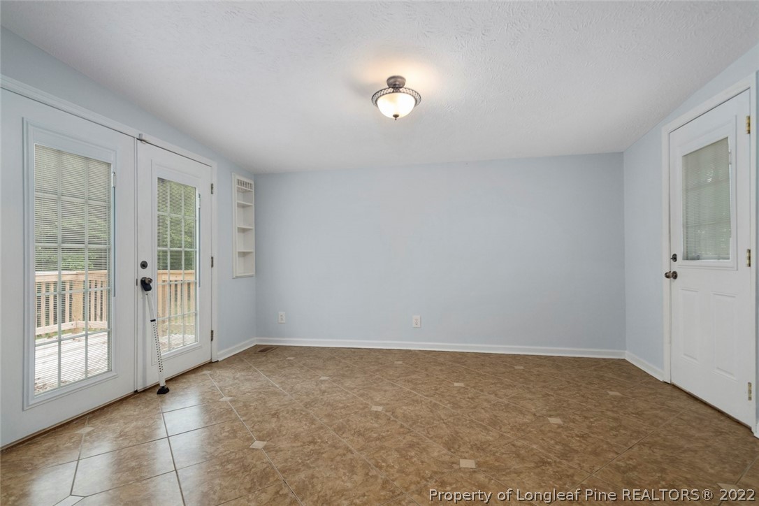 228 Overton Road Raeford, NC 28376 - Photo 8 of 23 a view of an empty room with a window