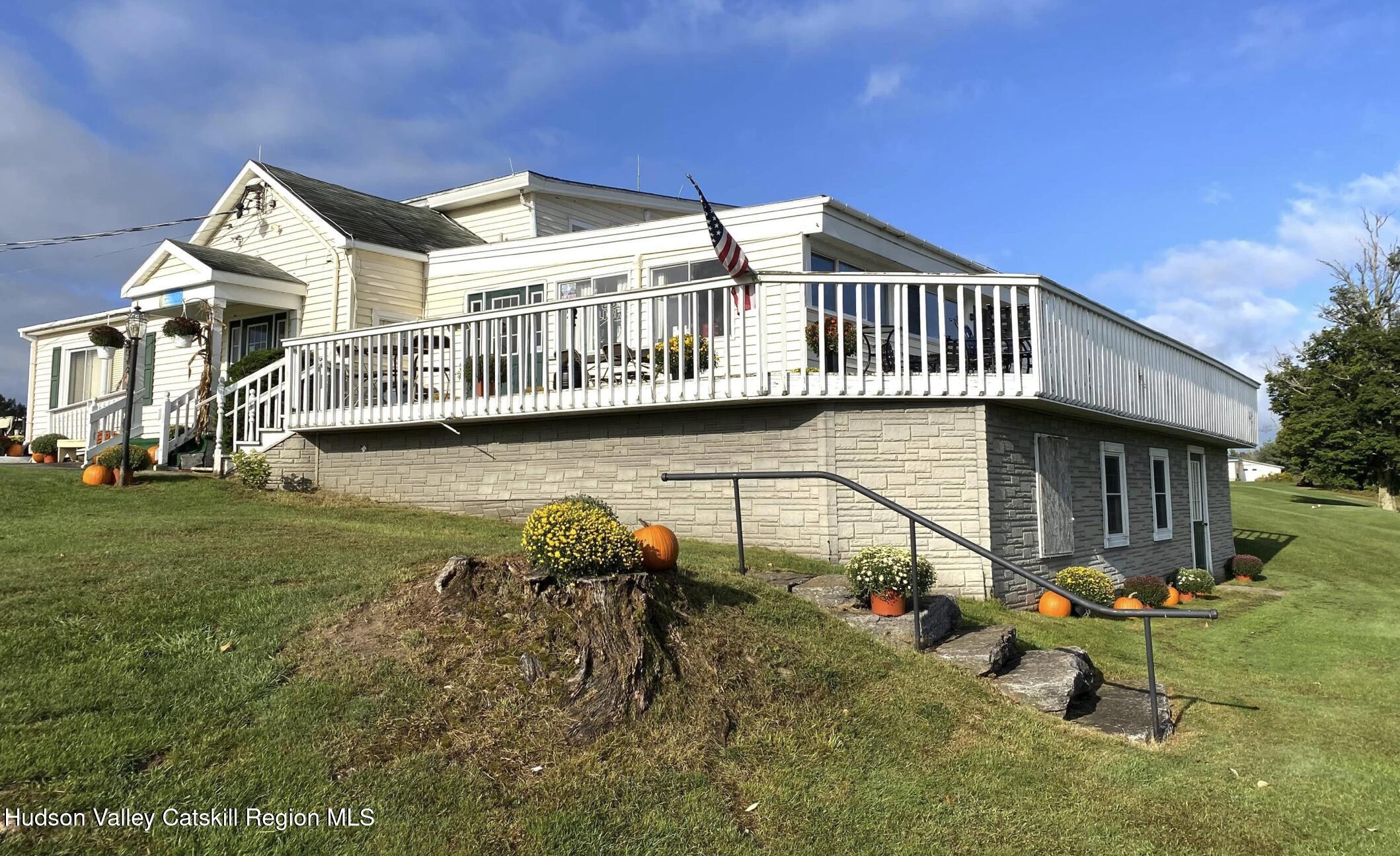 154 Golf Club Road Canajoharie, NY 13317 - Photo 5 of 45 a front view of a house with garden