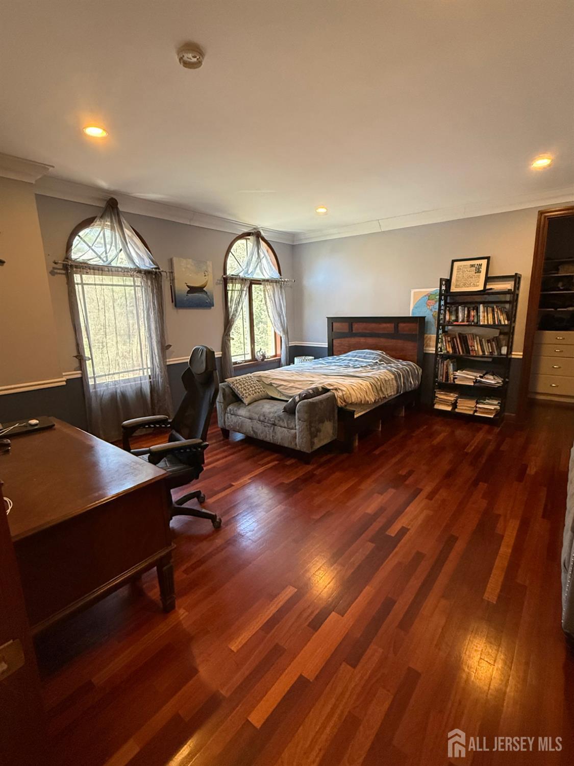 34 Line Road Holmdel, NJ 07733 - Photo 19 of 35 a bedroom with furniture and a wooden floor