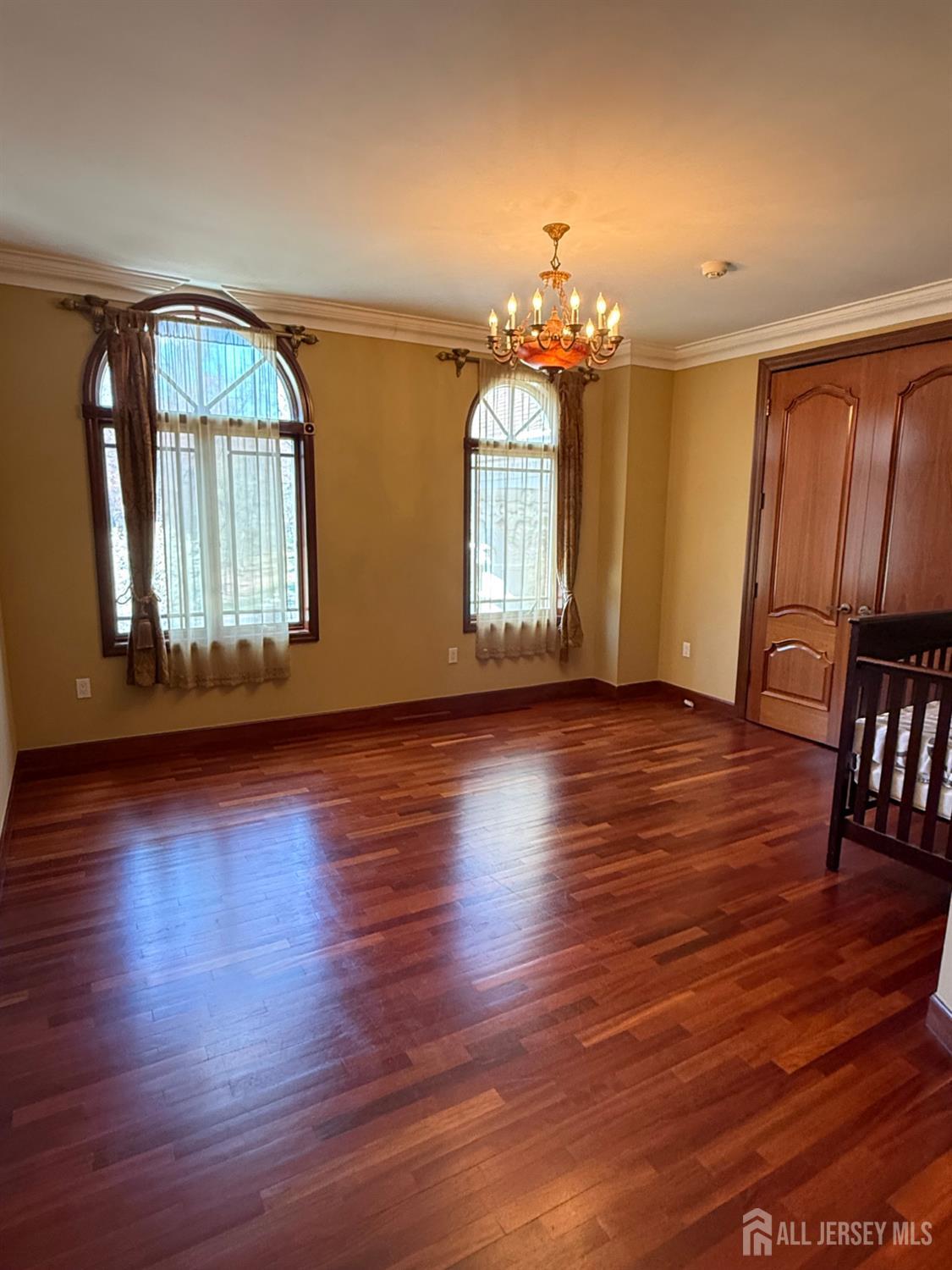 34 Line Road Holmdel, NJ 07733 - Photo 20 of 35 an empty room with wooden floor and windows