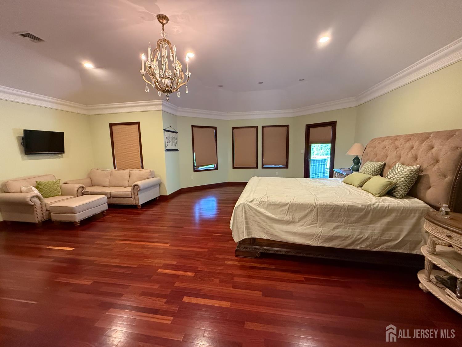 34 Line Road Holmdel, NJ 07733 - Photo 21 of 35 a spacious bedroom with a bed window and couch