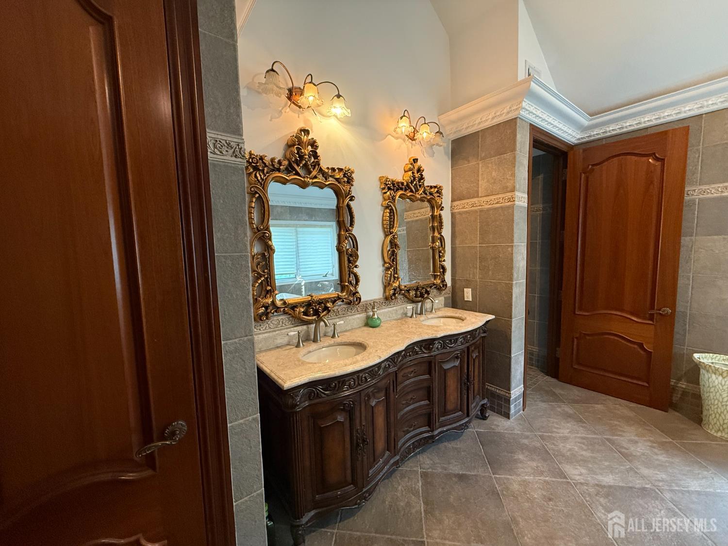 34 Line Road Holmdel, NJ 07733 - Photo 24 of 35 a bathroom with a double vanity sink and mirror