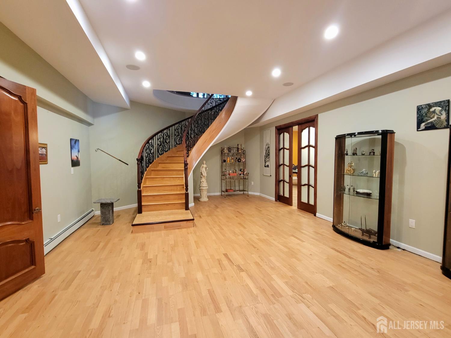 34 Line Road Holmdel, NJ 07733 - Photo 26 of 35 a view of an empty room with stairs and a window