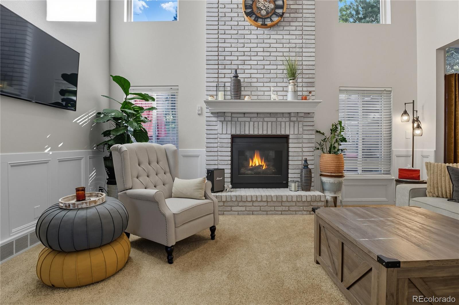 35 Ravenglass Way Colorado Springs, CO 80906 - Photo 20 of 45 a living room with furniture and a fireplace